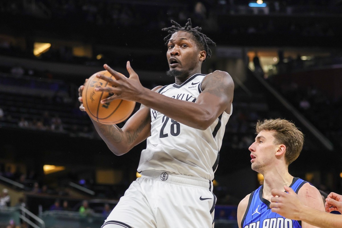 Brooklyn Nets forward Dorian Finney-Smith (28) grabs a rebound 